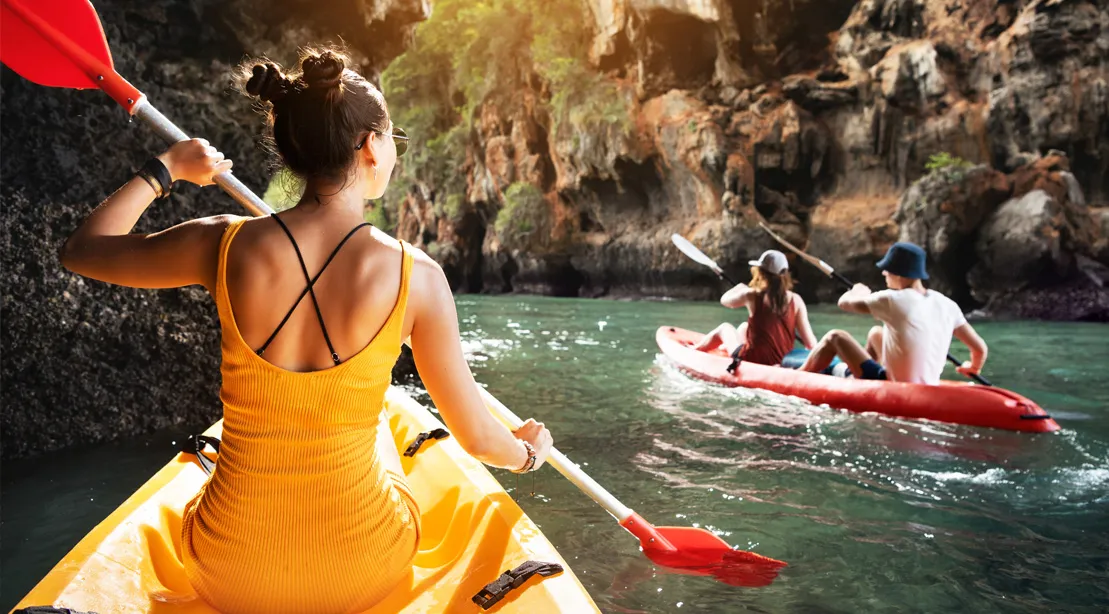 Outdoor Sports -Outdoor Sports Female kayaking in cavernous river